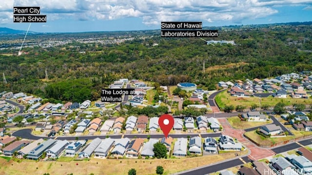 bird's eye view featuring a forest view and a residential view