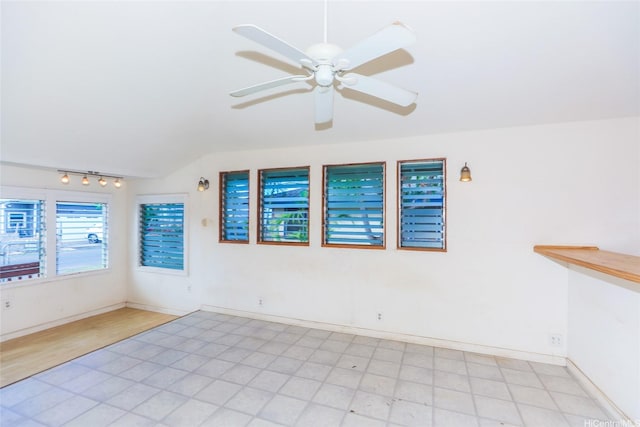 87-118 Alapaki St, Waianae, HI 96792 - empty room with a ceiling fan, track lighting, lofted ceiling, and light floors