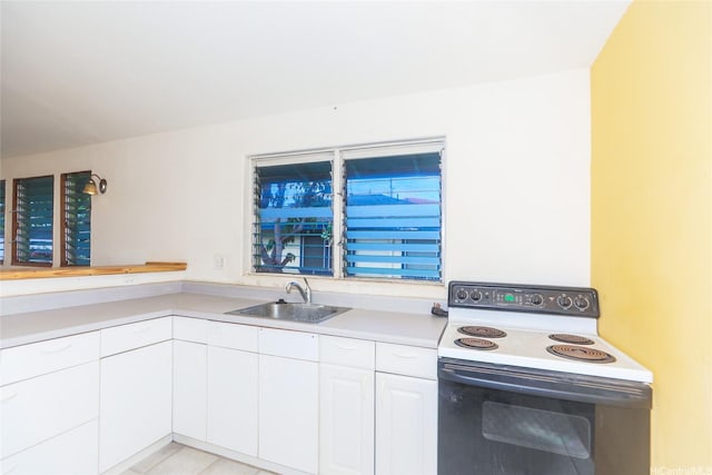 87-118 Alapaki St, Waianae, HI 96792 - kitchen featuring white electric range oven, white cabinets, and light countertops