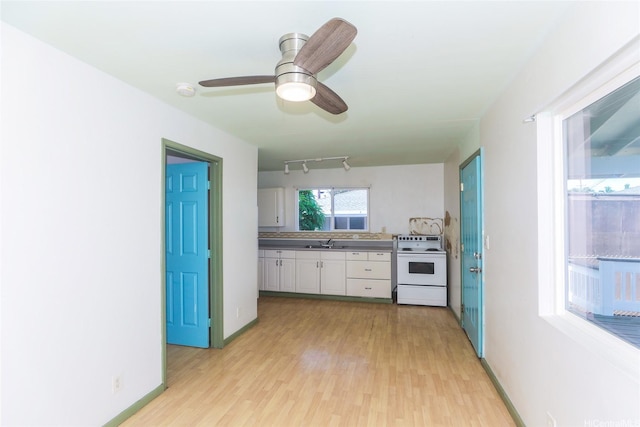 87-118 Alapaki St, Waianae, HI 96792 - kitchen featuring white range with electric stovetop, white cabinets, light wood-style floors, and ceiling fan