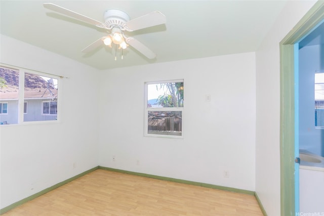 87-118 Alapaki St, Waianae, HI 96792 - spare room with light wood-style flooring, plenty of natural light, and a ceiling fan