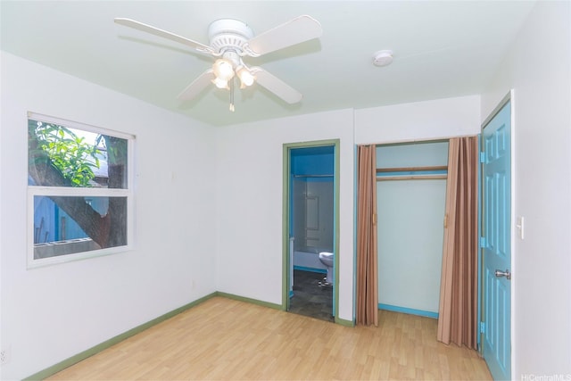 87-118 Alapaki St, Waianae, HI 96792 - unfurnished bedroom featuring wood finished floors, a closet, ensuite bath, and ceiling fan