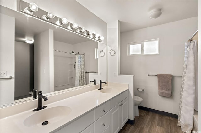 91-1159 Kanela St Unit M30, Ewa Beach, HI 96706 - full bathroom featuring toilet, double vanity, wood finished floors, and shower / bath combination with curtain