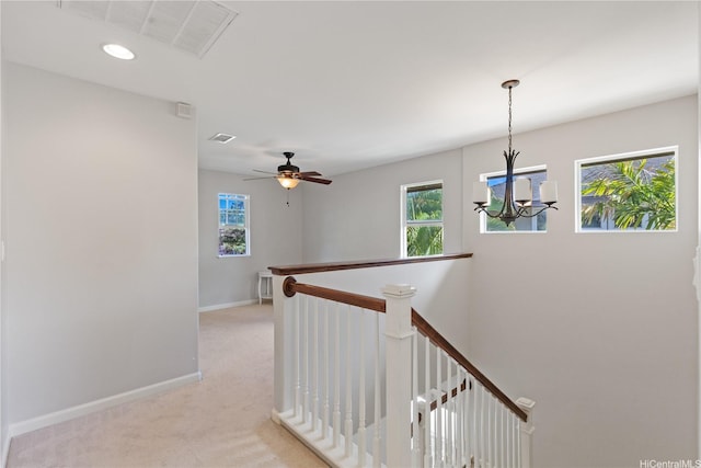 91-1036 Kaiuliuli St, Ewa Beach, HI 96706 - corridor featuring an upstairs landing, a chandelier, light carpet, baseboards, and recessed lighting