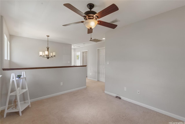91-1036 Kaiuliuli St, Ewa Beach, HI 96706 - spare room featuring light colored carpet, baseboards, a chandelier, and ceiling fan