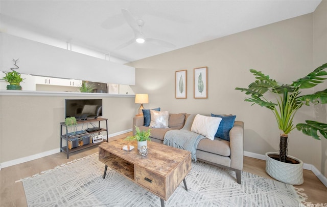 46-269 Kahuhipa St Unit D202, Kaneohe, HI 96744 - living area with a ceiling fan and wood finished floors