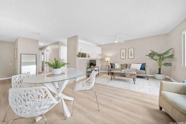 46-269 Kahuhipa St Unit D202, Kaneohe, HI 96744 - dining area featuring a ceiling fan and light wood-style floors