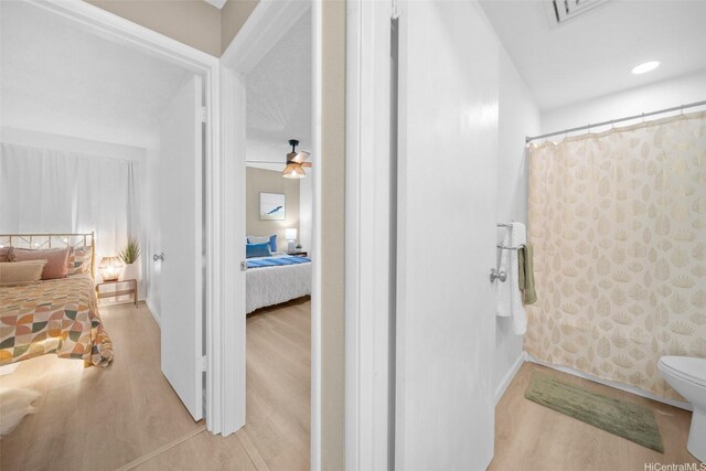 46-269 Kahuhipa St Unit D202, Kaneohe, HI 96744 - ensuite bathroom with wood finished floors and a shower with shower curtain