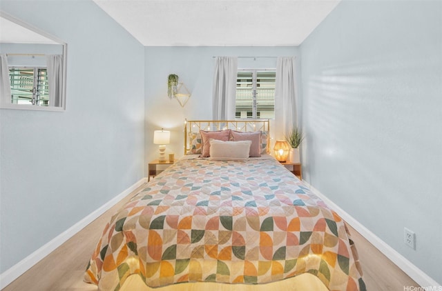 46-269 Kahuhipa St Unit D202, Kaneohe, HI 96744 - bedroom featuring baseboards and wood finished floors