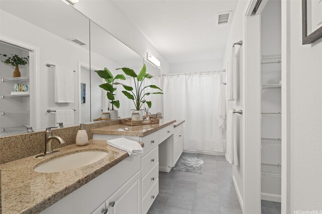 520 Lunalilo Home Rd Unit V1406, Honolulu, HI 96825 - bathroom with a spacious closet, vanity, tile patterned floors, a shower with curtain, and baseboards