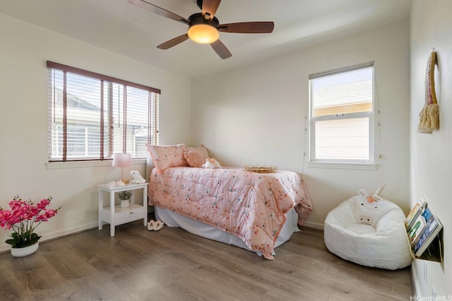 91-6221 Kapolei Pkwy Unit 511, Ewa Beach, HI 96706 - bedroom featuring wood finished floors and a ceiling fan