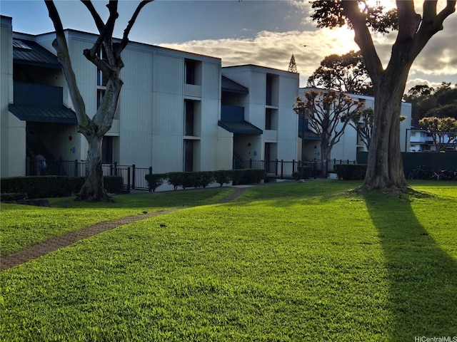view of building exterior featuring fence