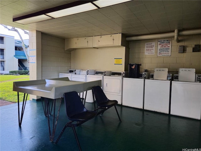 view of patio with independent washer and dryer and exterior kitchen