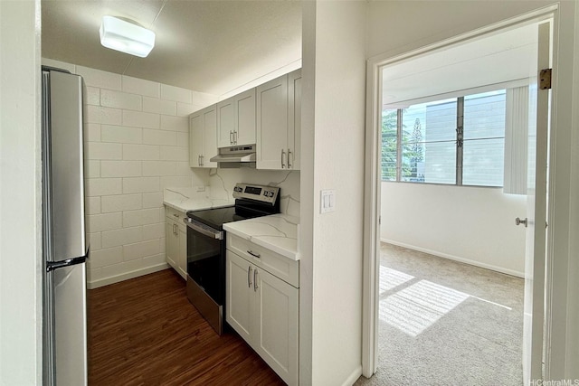95-029 Kuahelani Ave Unit 331, Mililani, HI 96789 - kitchen featuring appliances with stainless steel finishes, under cabinet range hood, light stone counters, and dark wood finished floors