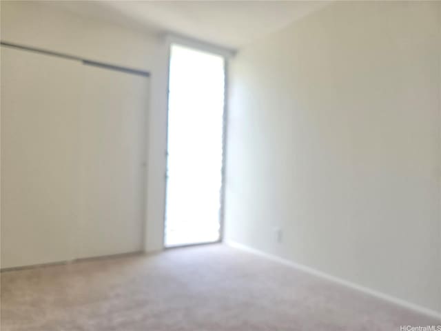 95-029 Kuahelani Ave Unit 331, Mililani, HI 96789 - carpeted empty room featuring baseboards