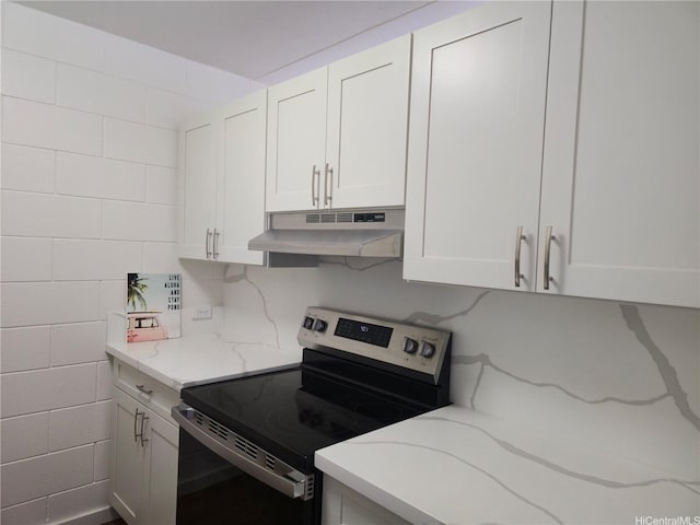 95-029 Kuahelani Ave Unit 331, Mililani, HI 96789 - kitchen featuring stainless steel electric range, under cabinet range hood, white cabinets, and light stone countertops