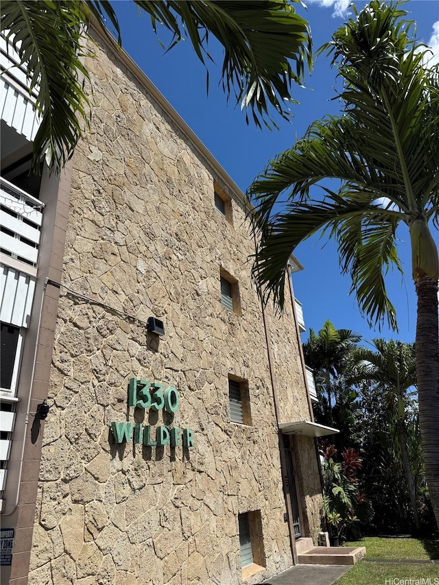 1330 Wilder Ave Unit 314, Honolulu, HI 96822 - view of side of home featuring stone siding