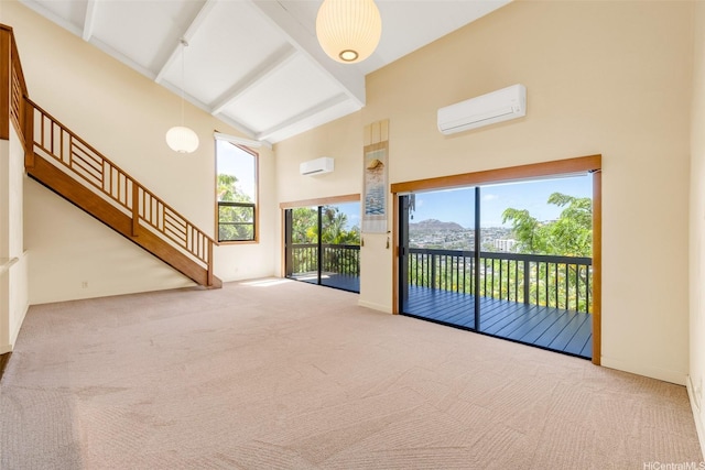 1487 Hiikala Pl Unit 44, Honolulu, HI 96816 - unfurnished room featuring high vaulted ceiling, carpet flooring, a wall mounted AC, stairs, and beam ceiling