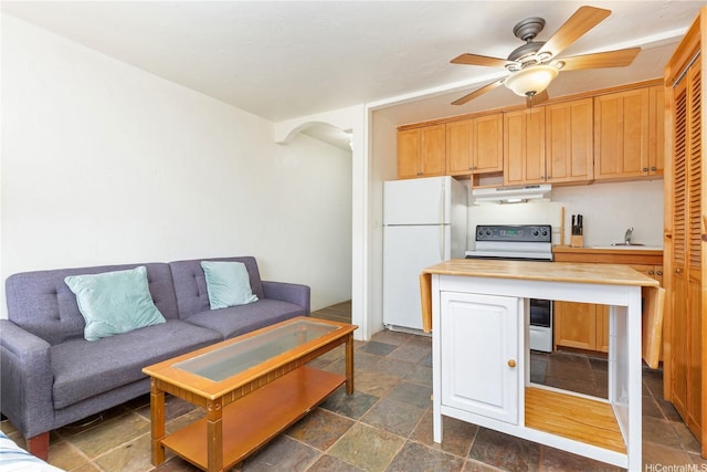 2345 Ala Wai Blvd Unit 1806, Honolulu, HI 96815 - kitchen featuring under cabinet range hood, white appliances, stone tile floors, ceiling fan, and butcher block counters