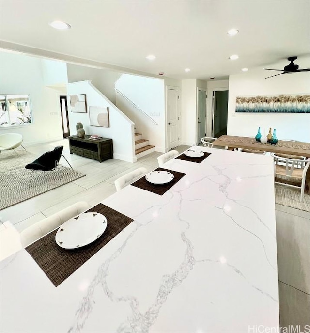 living room with stairs, recessed lighting, and a ceiling fan