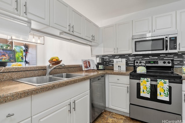 94-835 Lumiauau St Unit K105, Waipahu, HI 96797 - kitchen featuring stainless steel appliances, a sink, white cabinetry, and tasteful backsplash