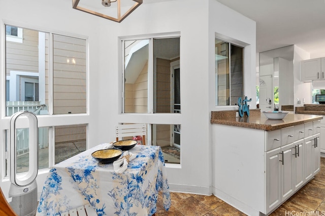 94-835 Lumiauau St Unit K105, Waipahu, HI 96797 - dining area featuring dark stone finish floors