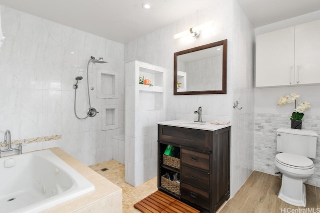 94-835 Lumiauau St Unit K105, Waipahu, HI 96797 - bathroom featuring tile walls, a whirlpool tub, vanity, tiled shower, and toilet