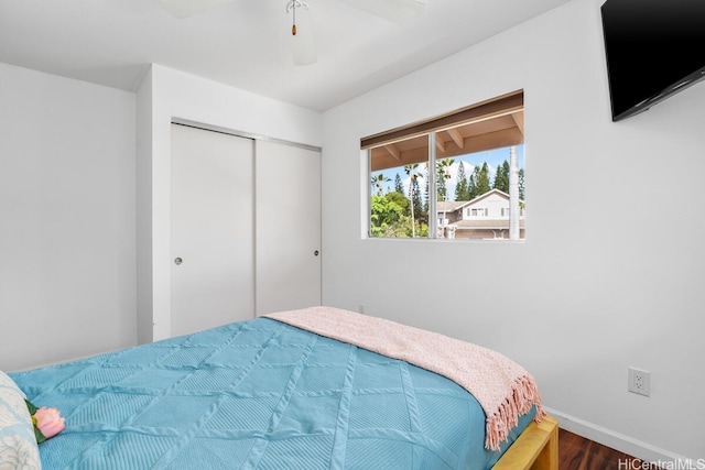 94-835 Lumiauau St Unit K105, Waipahu, HI 96797 - bedroom featuring a closet, baseboards, wood finished floors, and ceiling fan