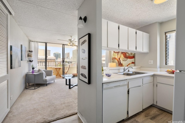 2240 Kuhio Ave Unit 812, Honolulu, HI 96815 - kitchen with white dishwasher, a sink, a textured ceiling, light countertops, and ceiling fan