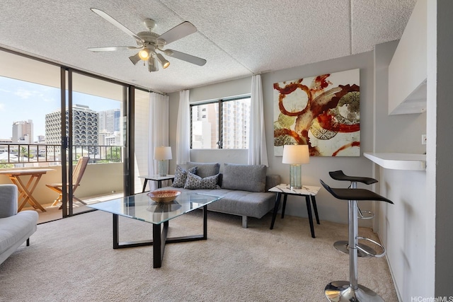 2240 Kuhio Ave Unit 812, Honolulu, HI 96815 - carpeted living room featuring a city view, ceiling fan, and a textured ceiling