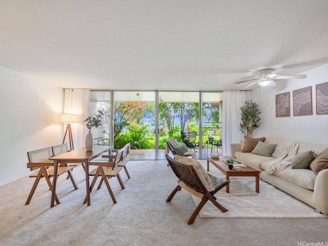 46-109 Konohiki St Unit 3913, Kaneohe, HI 96744 - carpeted living room featuring expansive windows, healthy amount of natural light, and a ceiling fan
