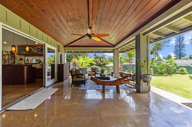 sunroom with marble finish floor, wood ceiling, and vaulted ceiling