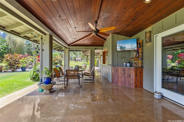 interior space with a ceiling fan and outdoor dining area
