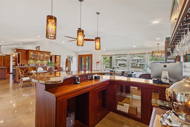 kitchen with glass insert cabinets, recessed lighting, a ceiling fan, stone counters, and decorative light fixtures