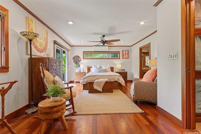 bedroom with crown molding, baseboards, and wood finished floors