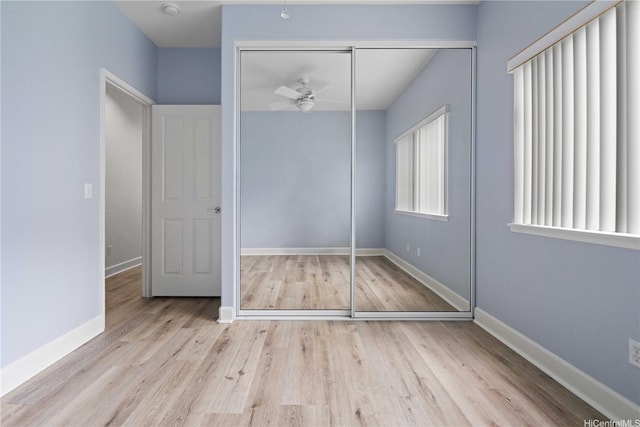 95-1023 Hehina St, Mililani, HI 96789 - unfurnished bedroom with a closet, baseboards, and wood finished floors