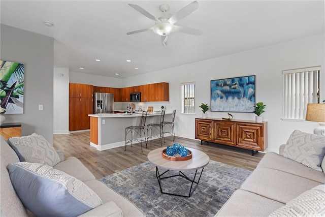 95-1023 Hehina St, Mililani, HI 96789 - living area featuring a ceiling fan, light wood-style floors, recessed lighting, and baseboards