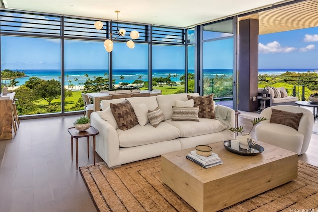 1388 Ala Moana Blvd Unit 7601, Honolulu, HI 96814 - sunroom / solarium featuring a wall of windows, a water view, healthy amount of natural light, and wood finished floors