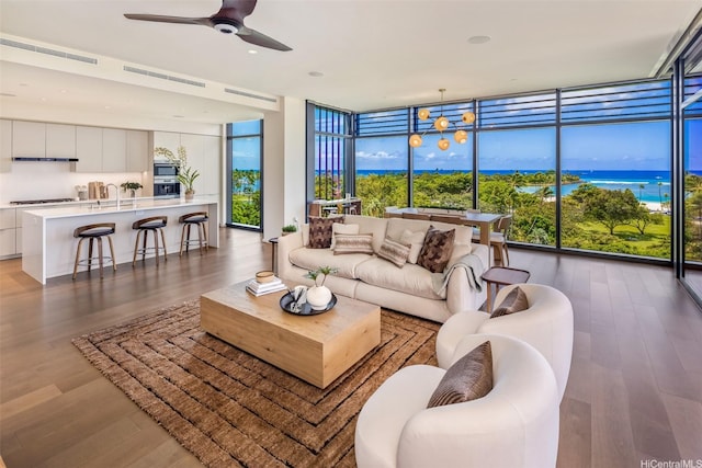 1388 Ala Moana Blvd Unit 7601, Honolulu, HI 96814 - living room featuring floor to ceiling windows, wood finished floors, and a ceiling fan