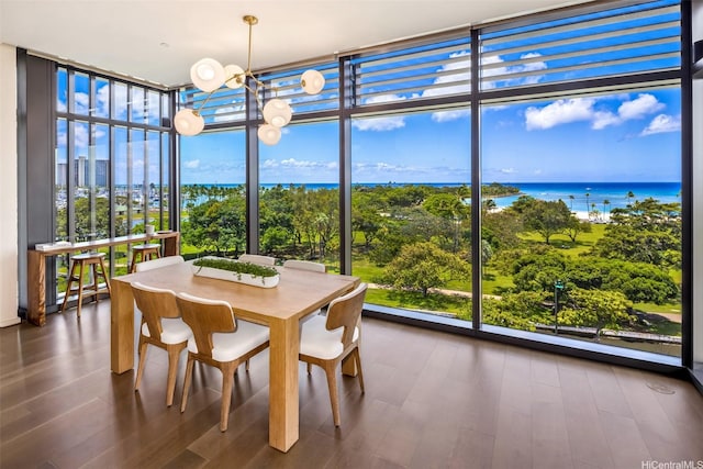 1388 Ala Moana Blvd Unit 7601, Honolulu, HI 96814 - sunroom with floor to ceiling windows, a chandelier, wood finished floors, and a water view