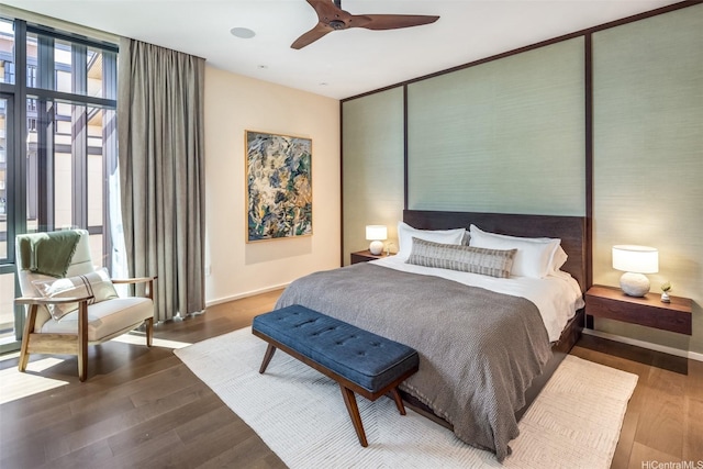 1388 Ala Moana Blvd Unit 7601, Honolulu, HI 96814 - bedroom with wood finished floors, baseboards, expansive windows, and a ceiling fan