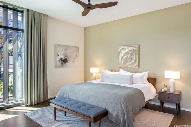 1388 Ala Moana Blvd Unit 7601, Honolulu, HI 96814 - bedroom with multiple windows, wood finished floors, baseboards, and a ceiling fan
