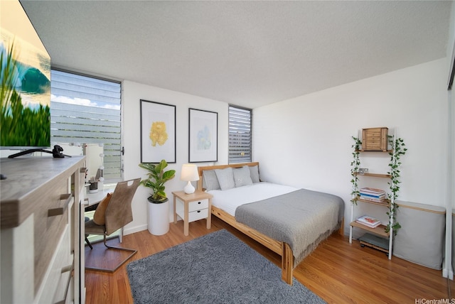 bedroom featuring wood finished floors