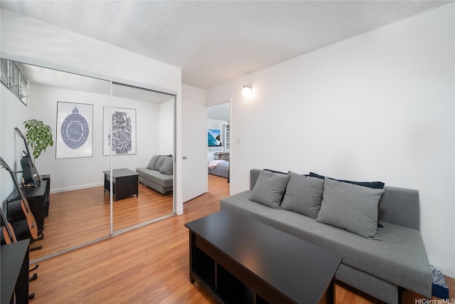 3030 Ala Ilima St Unit 301, Honolulu, HI 96818 - living area with light wood finished floors and a textured ceiling