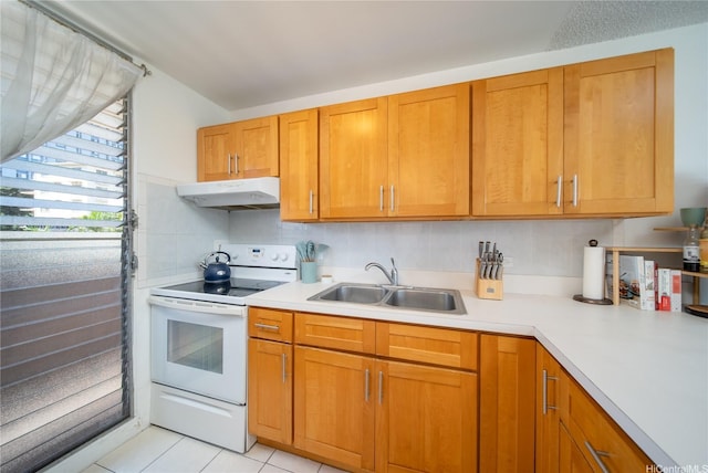 3030 Ala Ilima St Unit 301, Honolulu, HI 96818 - kitchen featuring under cabinet range hood, white electric range oven, light countertops, and light tile patterned floors
