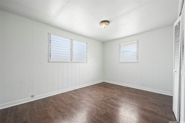 84-731 Upena St, Waianae, HI 96792 - unfurnished bedroom featuring dark wood-type flooring and baseboards