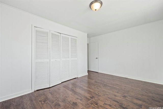 84-731 Upena St, Waianae, HI 96792 - unfurnished bedroom featuring dark wood-style flooring, a closet, and baseboards