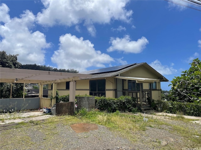 2929 Laelae Way, Honolulu, HI 96819 - view of front of property featuring roof mounted solar panels and covered porch