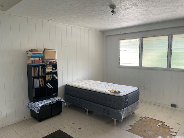 2929 Laelae Way, Honolulu, HI 96819 - bedroom featuring wooden walls, tile patterned floors, and a textured ceiling