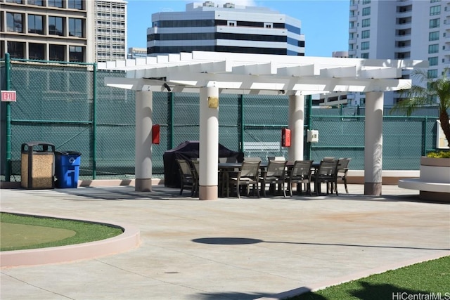 view of property's community featuring a pergola, a patio area, and fence